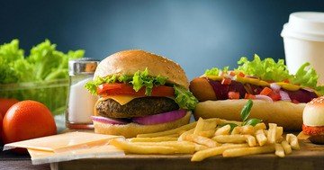 women's health magazine - unhealthy food at work can cause stomach and weight problems in the future